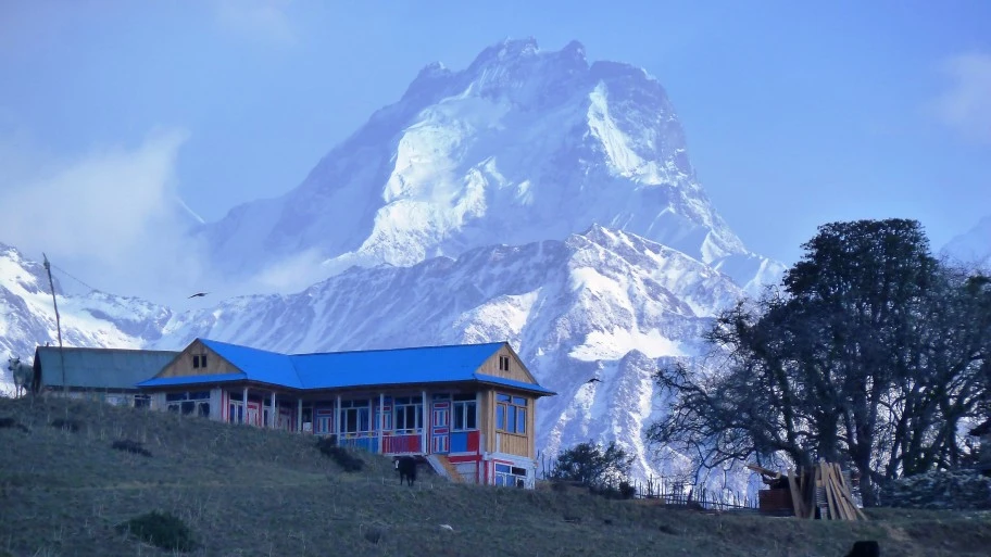 a house in front of a mountain in Nagthali, Langtang.