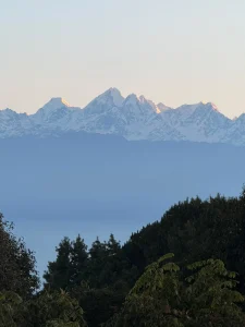 Beautiful Golden sun rays hitting the top of Dorje Lakpa Mountain range as seen during one of the best hikes near Kathmandu, Nagarkot.